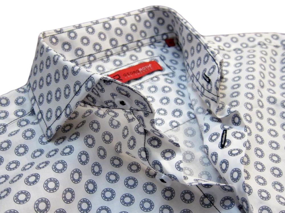 Casual and carefree....!  
You will absolutely love this midnight and white mini print.  
It is a soft cool, crisp Pima cotton fabric for comfort and easy washing.  Great with any jean or pant it will take you anywhere, anytime, day or evening.  
The sleeves having a coordinating white fabric that looks great when the cuffs are rolled.  
A perfect start for the up and coming summer season!
100% Pima Cotton