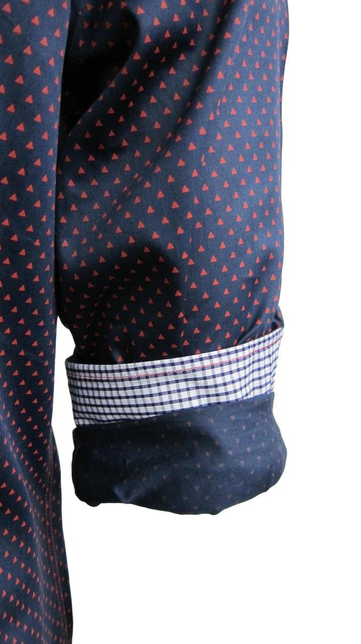 Richness and elegance describes this beautiful Navy &amp; Red cotton weave fabrication. A shirt to dress up, or go casual and roll the sleeves showing off the classic navy and white mini check inside the collar stand, front placket piping and cuffs.
Slightly tapered
Machine wash or dry clean

100 PIMA COTTON