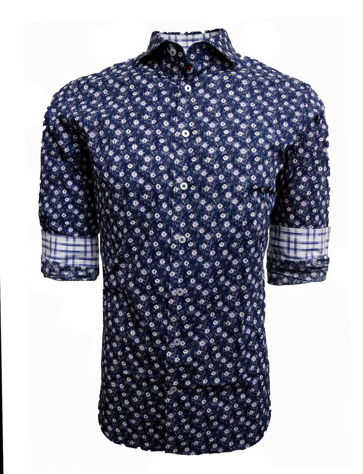 Known for our prints, this exclusive eye catching print is curated on our soft pima cotton. A stunning shade of indigo blue with white pattern is coordinated with a rich white, navy &amp; grey plaid inside the collar stand and cuffs. Looks terrific with the sleeves down or with the Georg Roth roll showing the handsome cuff detail.
100% Cotton
Machine wash cold hang to dry or dry clean 
